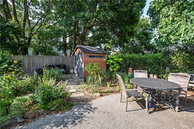 61 Penn St, Providence, RI 02909 - view of patio / terrace featuring a shed and outdoor dining space