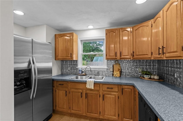 188 Reynolds Ave, Warwick, RI 02889 - kitchen featuring stainless steel refrigerator with ice dispenser, black dishwasher, tasteful backsplash, and brown cabinets