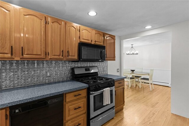 188 Reynolds Ave, Warwick, RI 02889 - kitchen featuring black appliances, dark countertops, a chandelier, tasteful backsplash, and recessed lighting