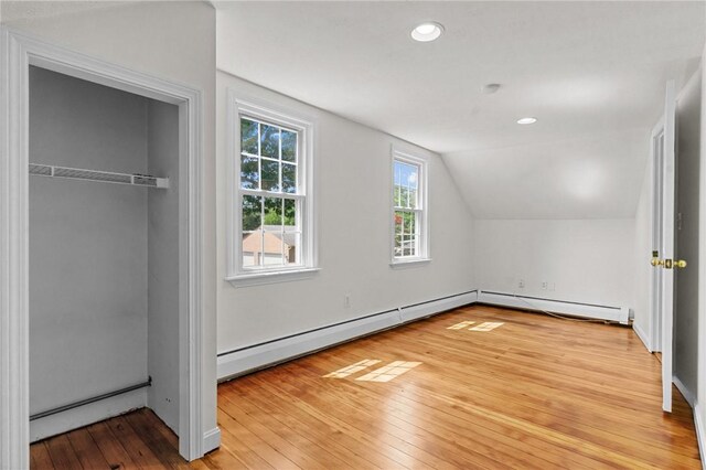 188 Reynolds Ave, Warwick, RI 02889 - additional living space featuring lofted ceiling, light wood-style floors, a baseboard radiator, and recessed lighting