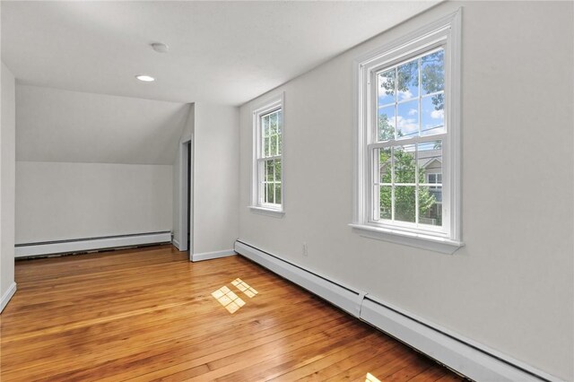 188 Reynolds Ave, Warwick, RI 02889 - bonus room featuring baseboard heating, light wood-style floors, and vaulted ceiling