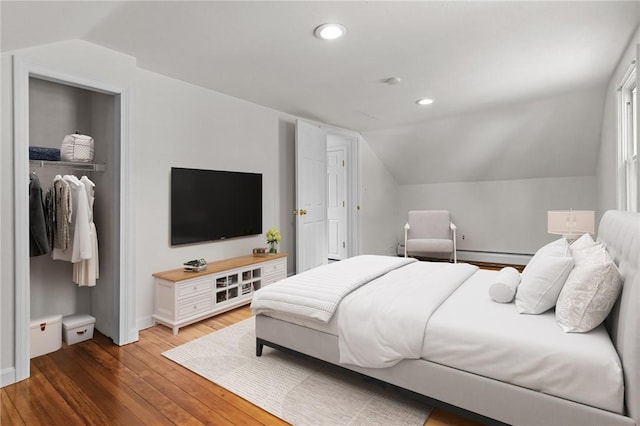188 Reynolds Ave, Warwick, RI 02889 - bedroom featuring vaulted ceiling, a baseboard heating unit, wood finished floors, a closet, and recessed lighting