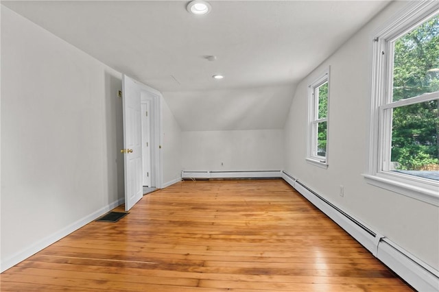 188 Reynolds Ave, Warwick, RI 02889 - bonus room with a baseboard radiator, vaulted ceiling, plenty of natural light, recessed lighting, and light wood-style flooring