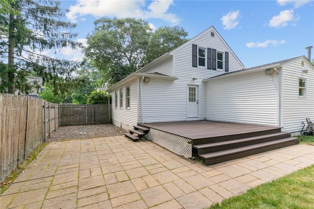 188 Reynolds Ave, Warwick, RI 02889 - rear view of property featuring a fenced backyard, a deck, and a patio