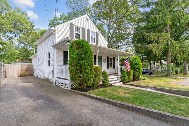 188 Reynolds Ave, Warwick, RI 02889 - view of front of house with a porch and asphalt driveway