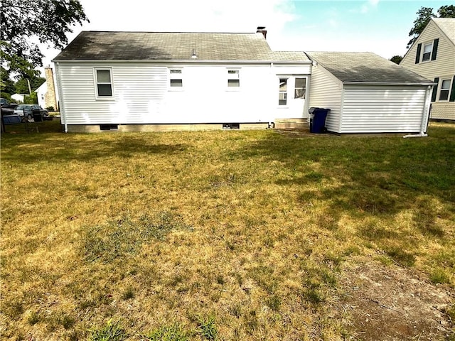 94 Alvin St, Warwick, RI 02886 - rear view of property with a lawn and roof with shingles