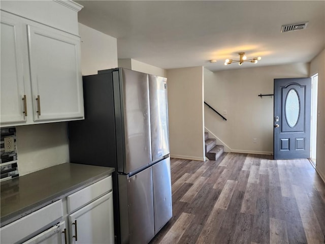 93 Dixon St Unit 1Front, Providence, RI 02907 - kitchen with freestanding refrigerator, dark wood-type flooring, and white cabinetry