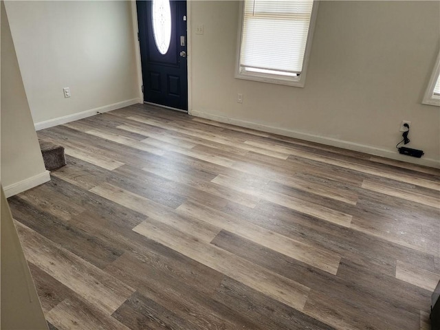 93 Dixon St Unit 1Front, Providence, RI 02907 - entryway with baseboards and wood finished floors