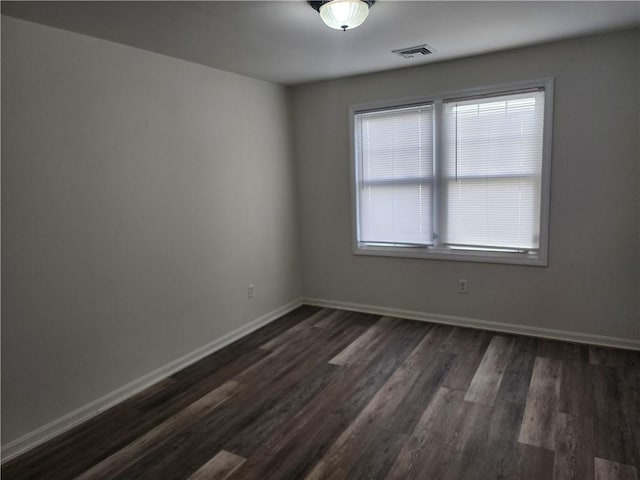93 Dixon St Unit 1Front, Providence, RI 02907 - spare room with dark wood-style flooring and baseboards