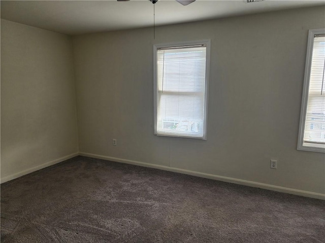 93 Dixon St Unit 1Front, Providence, RI 02907 - empty room featuring dark colored carpet, healthy amount of natural light, and ceiling fan