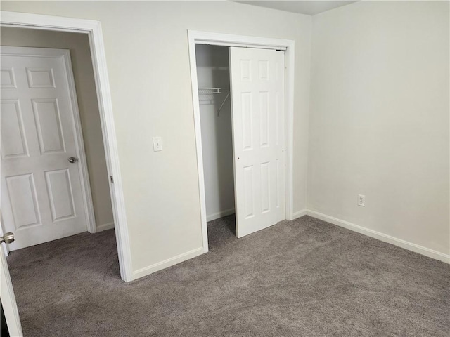 93 Dixon St Unit 1Front, Providence, RI 02907 - unfurnished bedroom featuring dark colored carpet and a closet