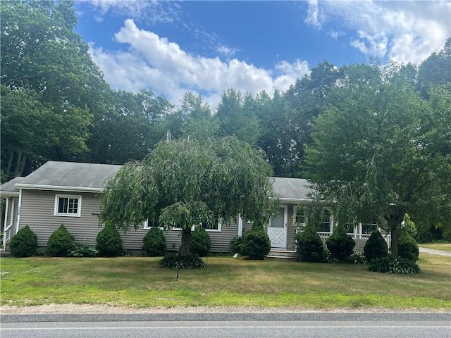 354 Rhodes Ave, Woonsocket, RI 02895 - view of property hidden behind natural elements with a front yard