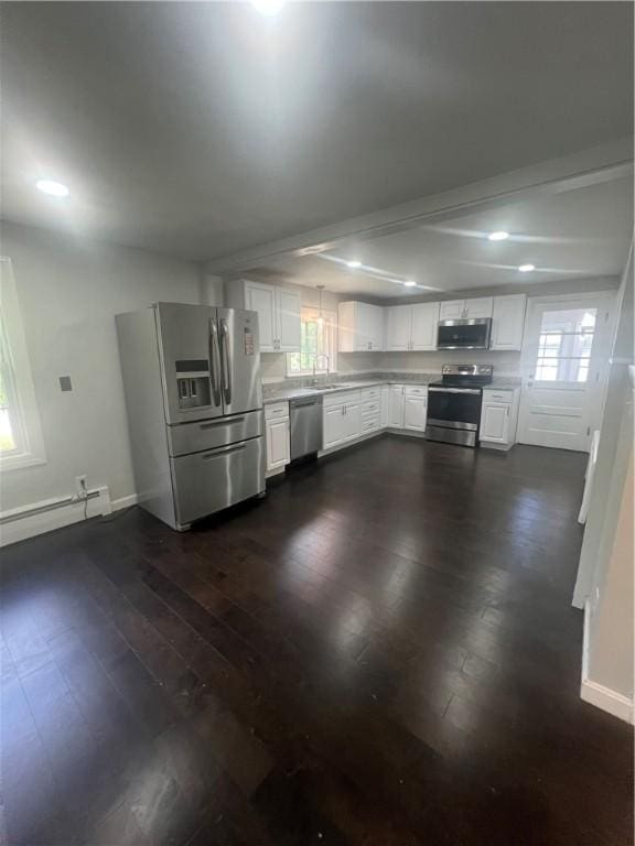 354 Rhodes Ave, Woonsocket, RI 02895 - kitchen with appliances with stainless steel finishes, a baseboard radiator, light countertops, healthy amount of natural light, and recessed lighting