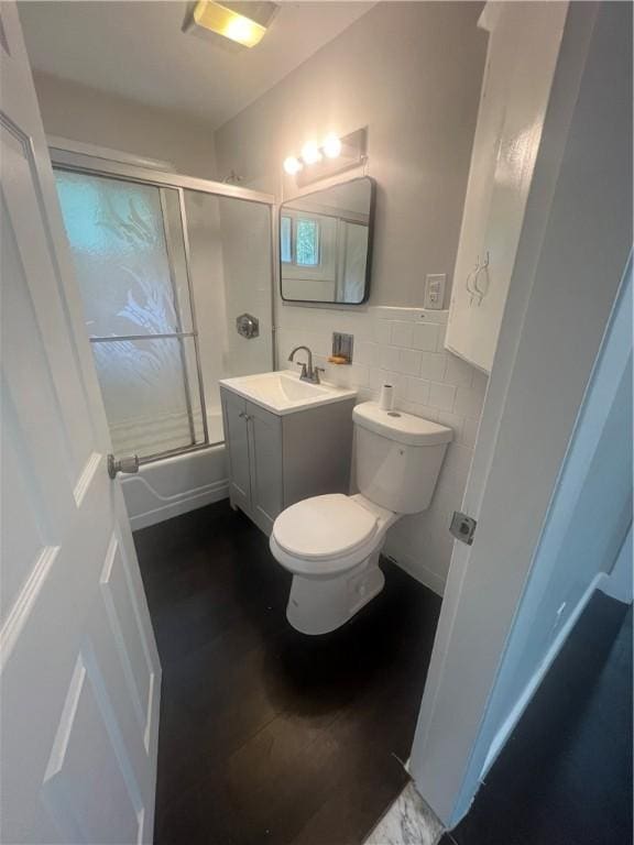 354 Rhodes Ave, Woonsocket, RI 02895 - full bathroom with shower / bath combination with glass door, vanity, tile walls, and wood finished floors