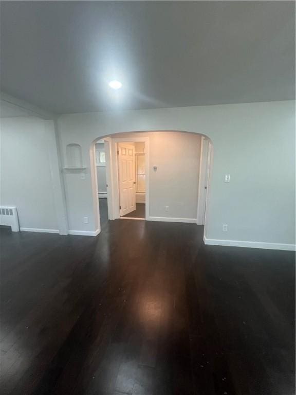 354 Rhodes Ave, Woonsocket, RI 02895 - spare room featuring arched walkways and dark wood finished floors