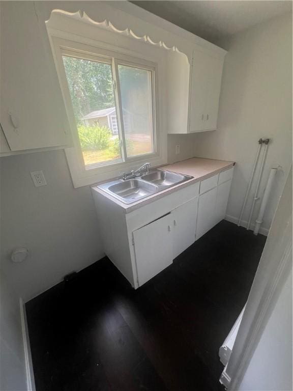 354 Rhodes Ave, Woonsocket, RI 02895 - kitchen featuring white cabinets, light countertops, and dark wood-style floors