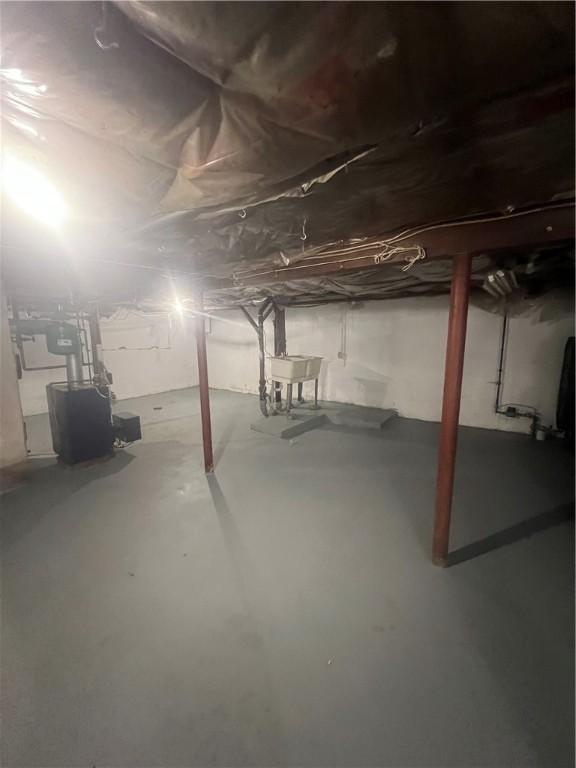 354 Rhodes Ave, Woonsocket, RI 02895 - unfinished below grade area featuring a sink