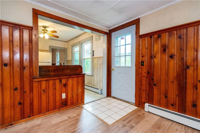 3442 Flat River Rd, Coventry, RI 02816 - foyer with a baseboard radiator, wallpapered walls, ornamental molding, light wood-style flooring, and ceiling fan