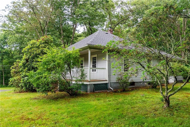 3442 Flat River Rd, Coventry, RI 02816 - view of front of property with a porch, a front yard, a chimney, and roof with shingles