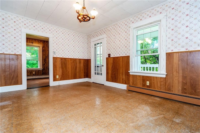 3442 Flat River Rd, Coventry, RI 02816 - spare room with wainscoting, wood walls, a chandelier, a baseboard radiator, and tile patterned floors