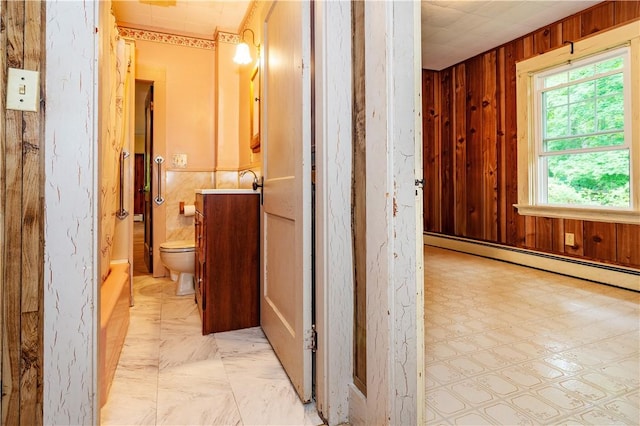 3442 Flat River Rd, Coventry, RI 02816 - bathroom featuring wooden walls and a baseboard heating unit