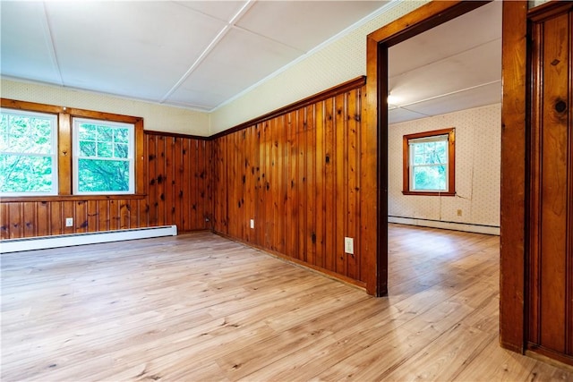 3442 Flat River Rd, Coventry, RI 02816 - unfurnished room featuring a baseboard radiator, plenty of natural light, light wood-type flooring, and wallpapered walls