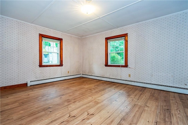 3442 Flat River Rd, Coventry, RI 02816 - unfurnished room featuring plenty of natural light, hardwood / wood-style flooring, crown molding, and baseboard heating