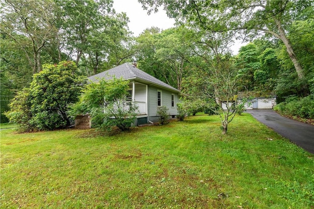3442 Flat River Rd, Coventry, RI 02816 - view of side of home with a lawn, a porch, and a chimney
