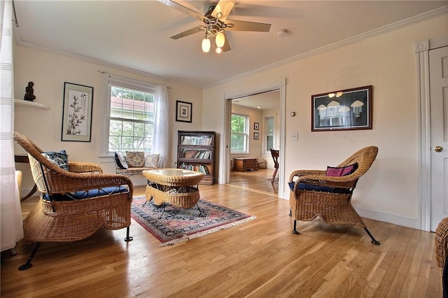 46 Highland Ave, Westerly, RI 02891 - living room with light wood finished floors, ornamental molding, and ceiling fan