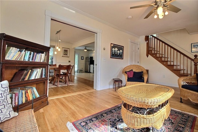 46 Highland Ave, Westerly, RI 02891 - living area with ceiling fan, light wood-style floors, ornamental molding, and stairway