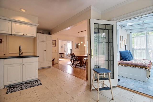 46 Highland Ave, Westerly, RI 02891 - kitchen with crown molding, light tile patterned flooring, white cabinets, dark countertops, and recessed lighting