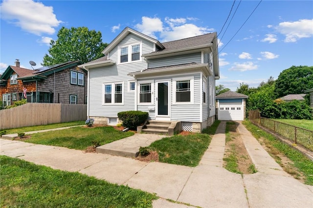 8 Parkman St, Providence, RI 02907 - view of front of house featuring concrete driveway, a detached garage, and an outdoor structure