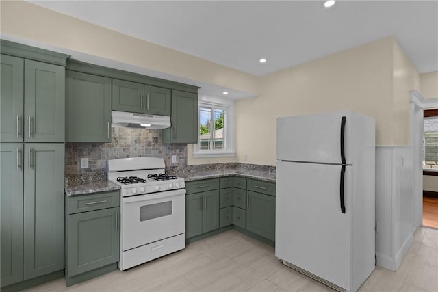 8 Parkman St, Providence, RI 02907 - kitchen with green cabinets, white appliances, under cabinet range hood, healthy amount of natural light, and recessed lighting