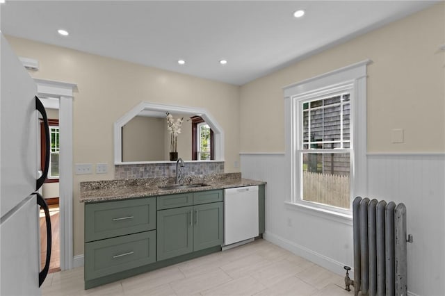 8 Parkman St, Providence, RI 02907 - kitchen featuring green cabinets, dishwasher, radiator heating unit, freestanding refrigerator, and wainscoting