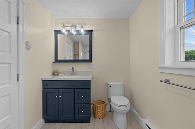 8 Parkman St, Providence, RI 02907 - bathroom featuring vanity and a baseboard heating unit