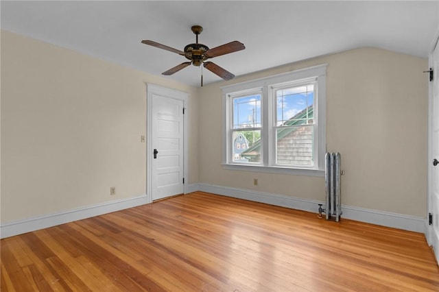 8 Parkman St, Providence, RI 02907 - unfurnished room with radiator heating unit, a ceiling fan, light wood-type flooring, and lofted ceiling
