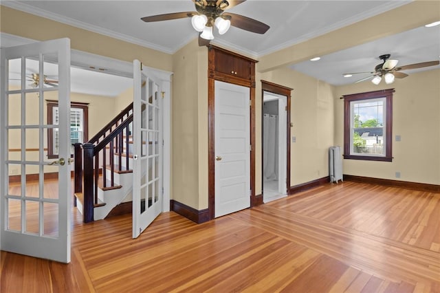 8 Parkman St, Providence, RI 02907 - spare room with ceiling fan, radiator heating unit, french doors, and ornamental molding