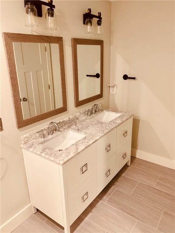 724 Centerville Rd Unit 6, Warwick, RI 02886 - full bath with double vanity and baseboards