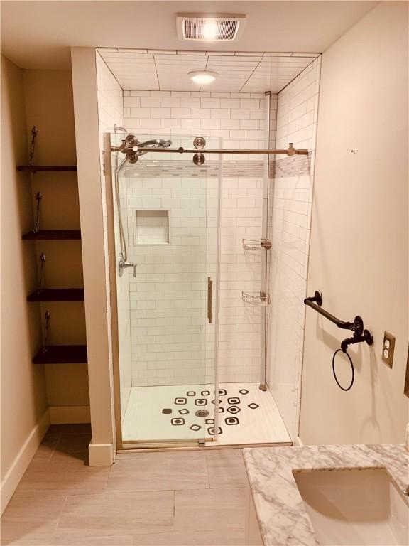 724 Centerville Rd Unit 6, Warwick, RI 02886 - bathroom with a shower stall and baseboards