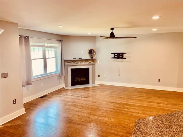 724 Centerville Rd Unit 6, Warwick, RI 02886 - unfurnished living room featuring wood finished floors, a ceiling fan, a fireplace with flush hearth, and recessed lighting