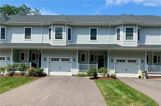 724 Centerville Rd Unit 6, Warwick, RI 02886 - townhome / multi-family property featuring a porch, driveway, and a garage