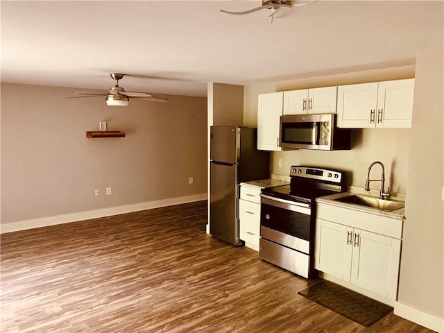 724 Centerville Rd Unit 6, Warwick, RI 02886 - kitchen with stainless steel appliances, ceiling fan, white cabinets, and dark wood-type flooring