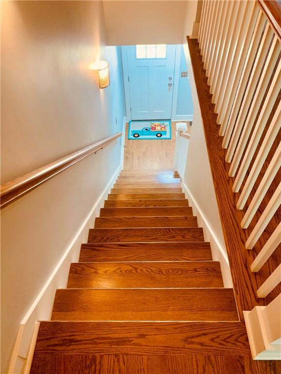 724 Centerville Rd Unit 6, Warwick, RI 02886 - stairway with wood finished floors and baseboards