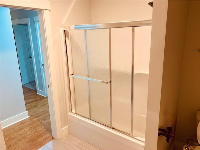 724 Centerville Rd Unit 6, Warwick, RI 02886 - full bath featuring wood finished floors and bath / shower combo with glass door