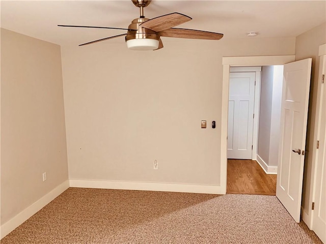 724 Centerville Rd Unit 6, Warwick, RI 02886 - empty room with a ceiling fan, a smoke detector, and light colored carpet