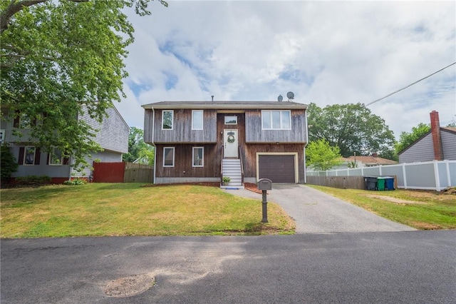36 Wadsworth St, Warwick, RI 02889 - split foyer home with asphalt driveway and a garage