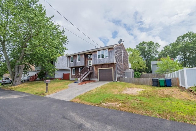 36 Wadsworth St, Warwick, RI 02889 - split foyer home featuring driveway, a garage, and stairs