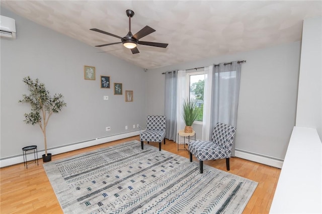 36 Wadsworth St, Warwick, RI 02889 - living area featuring a baseboard radiator, vaulted ceiling, a wall mounted air conditioner, wood finished floors, and ceiling fan