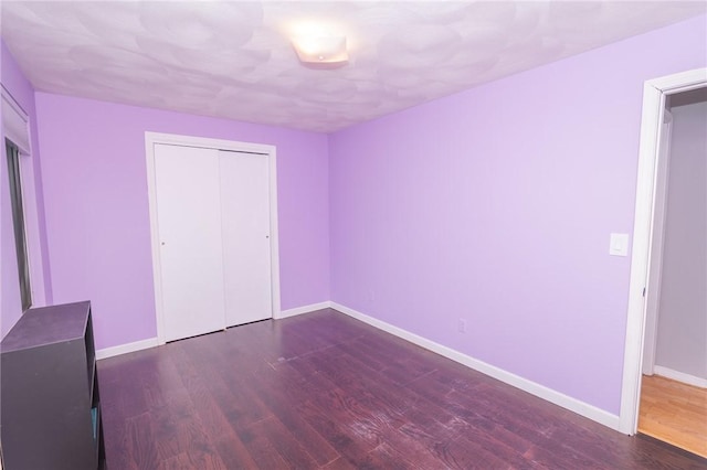 36 Wadsworth St, Warwick, RI 02889 - unfurnished bedroom with dark wood finished floors and a closet