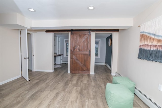 36 Wadsworth St, Warwick, RI 02889 - interior space featuring a baseboard radiator, light wood-type flooring, a baseboard heating unit, and recessed lighting